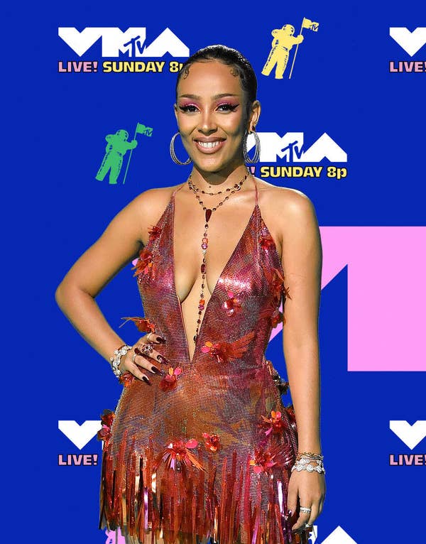 Doja Cat posed in a dress with a deep v-cut 