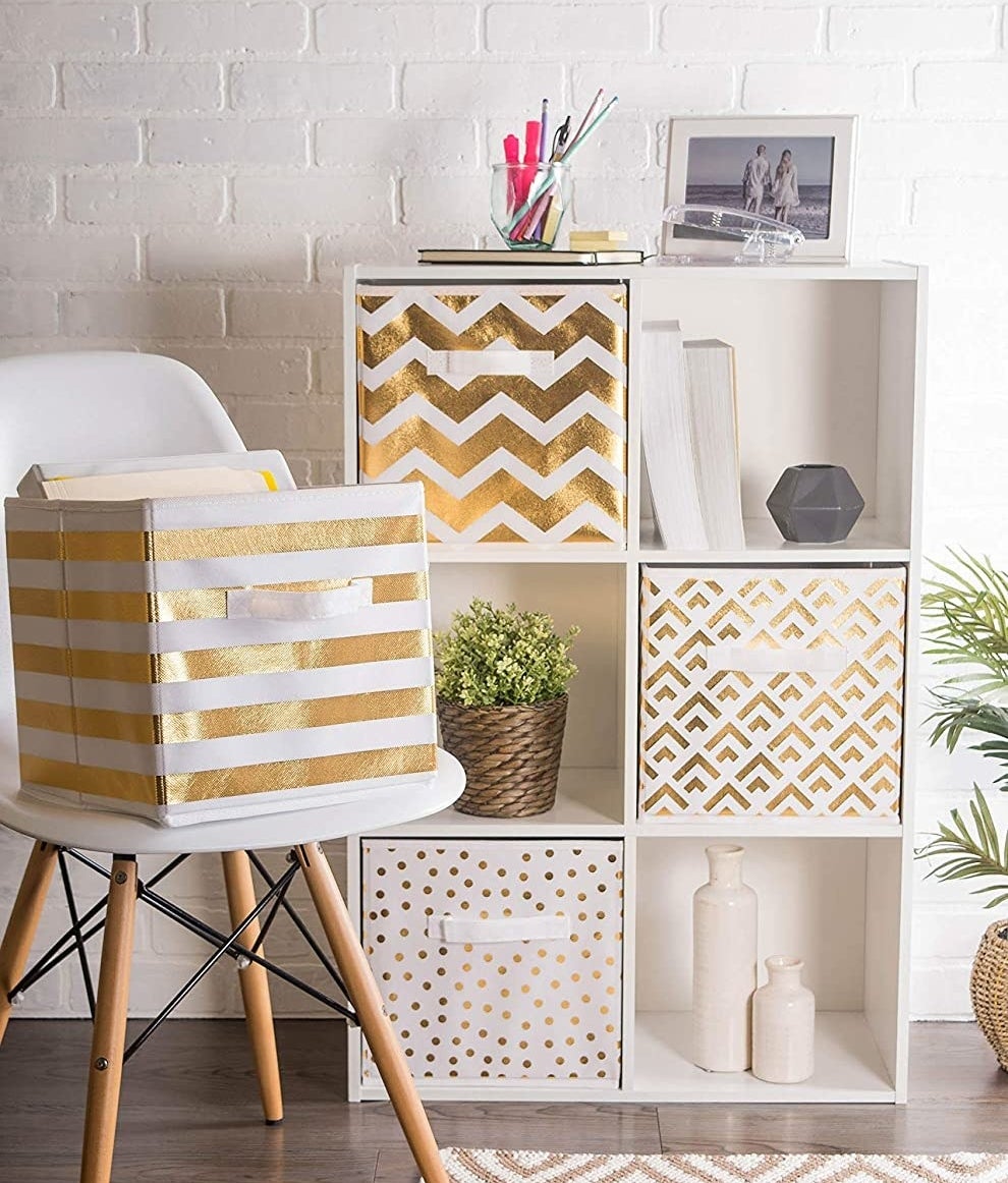 The fabric storage bins in a shelving unit