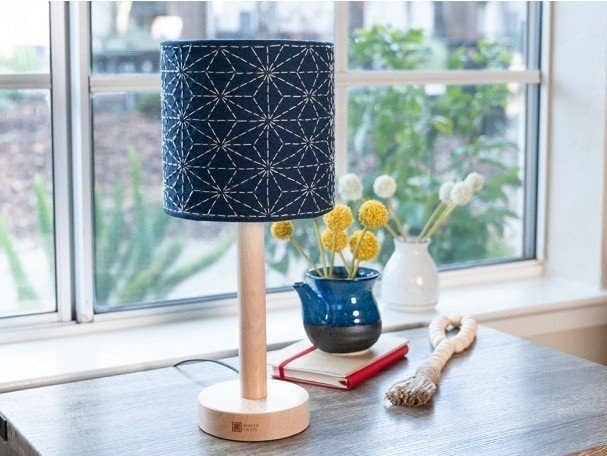 a blue hand embroidered lamp