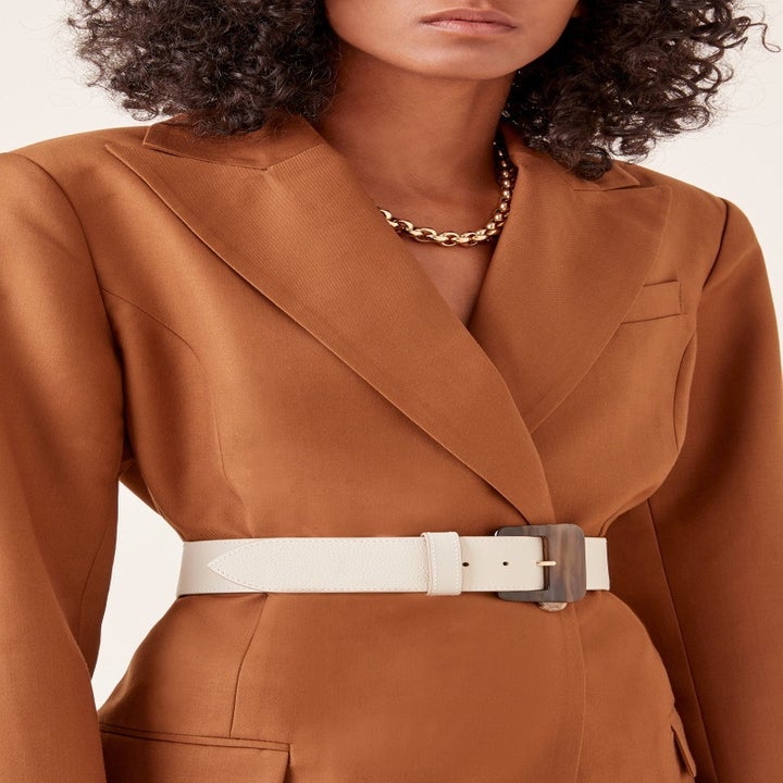 Model wearing the white leather belt on their waist