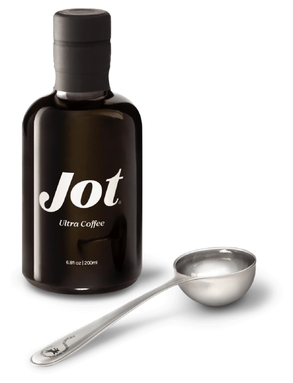A dark bottle of Jot coffee with a silver measuring spoon