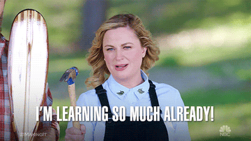 A GIF of Amy Poehler holding a hammer and saying I&#x27;m learning so much already