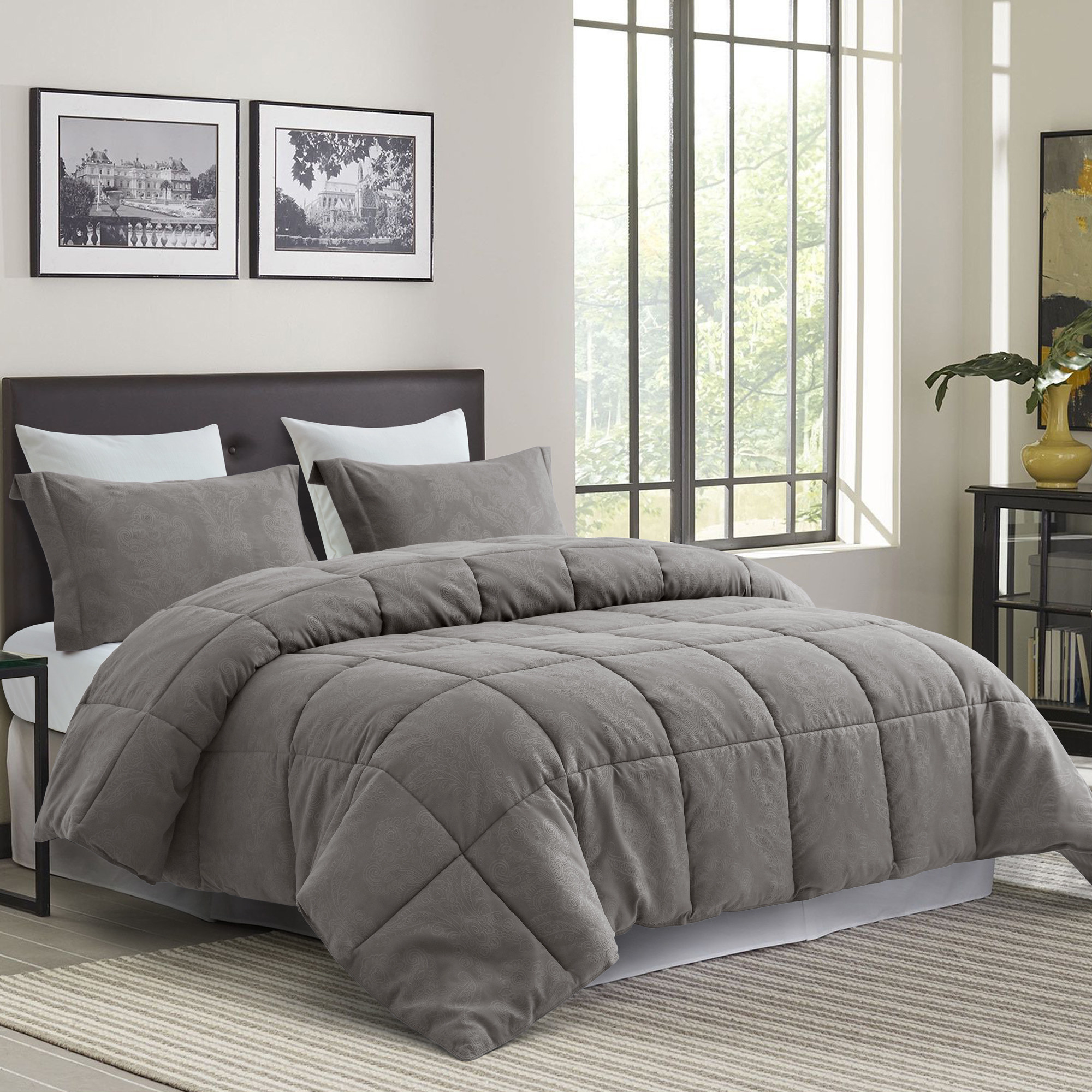 The grey comforter on a bed