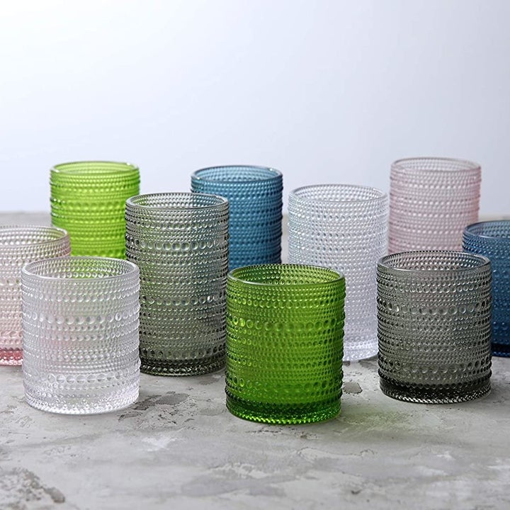 A series of glasses neatly arranged on a counter  