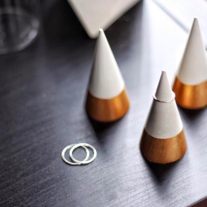 A trio of ring cones on a vanity