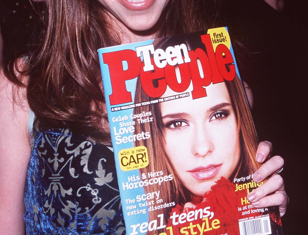 A close-up of Jennifer Love Hewitt holding a Teen People with herself on the cover