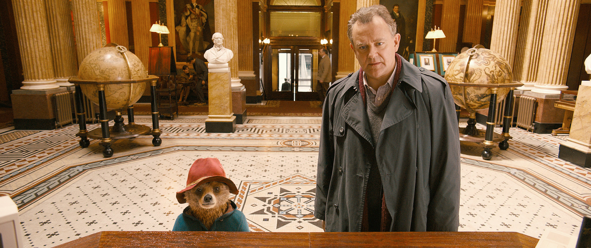 Paddington standing next to Mr Brown