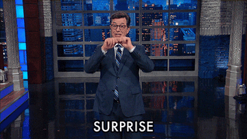 Stephen Colbert miming &#x27;Surprise.&#x27;