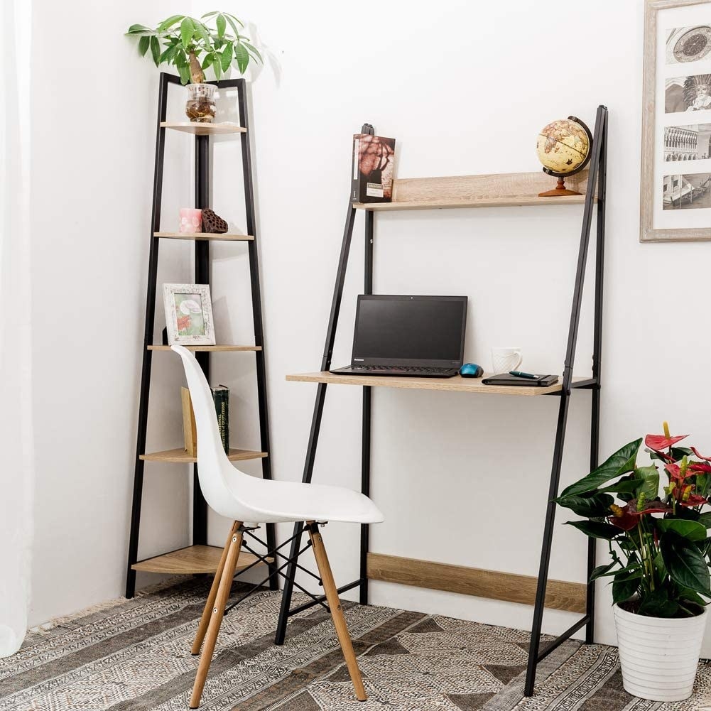 A wooden desk with a metal frame and a small shelf above