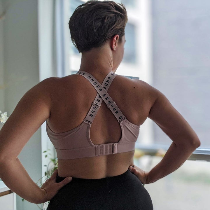 A back view of the bra, which has criss-cross straps and a hook closure