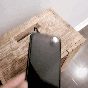 GIF of a phone being placed on the wireless charger and it immediately beginning to charge