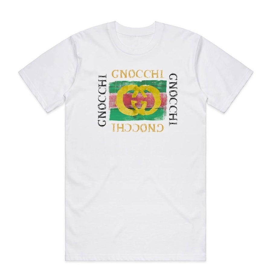 The short-sleeved white tee with a design that looks like the Gucci logo but says "Gnocchi" all around it instead