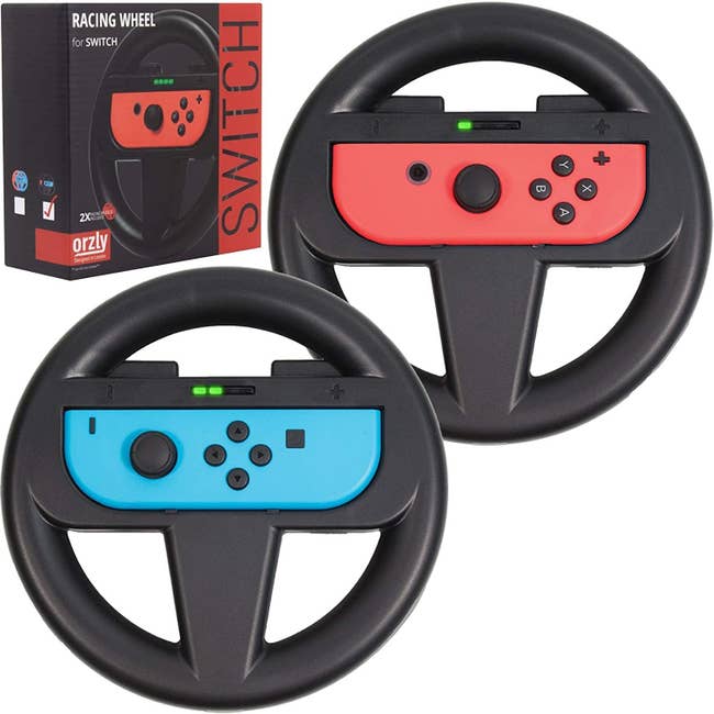 two black steering wheels with a joycon fitted inside each