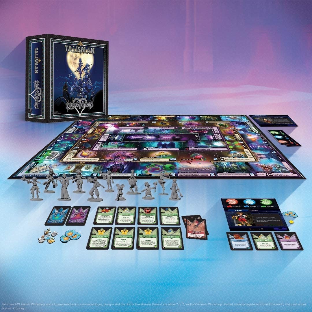 the board game with various character pieces from the game and cards