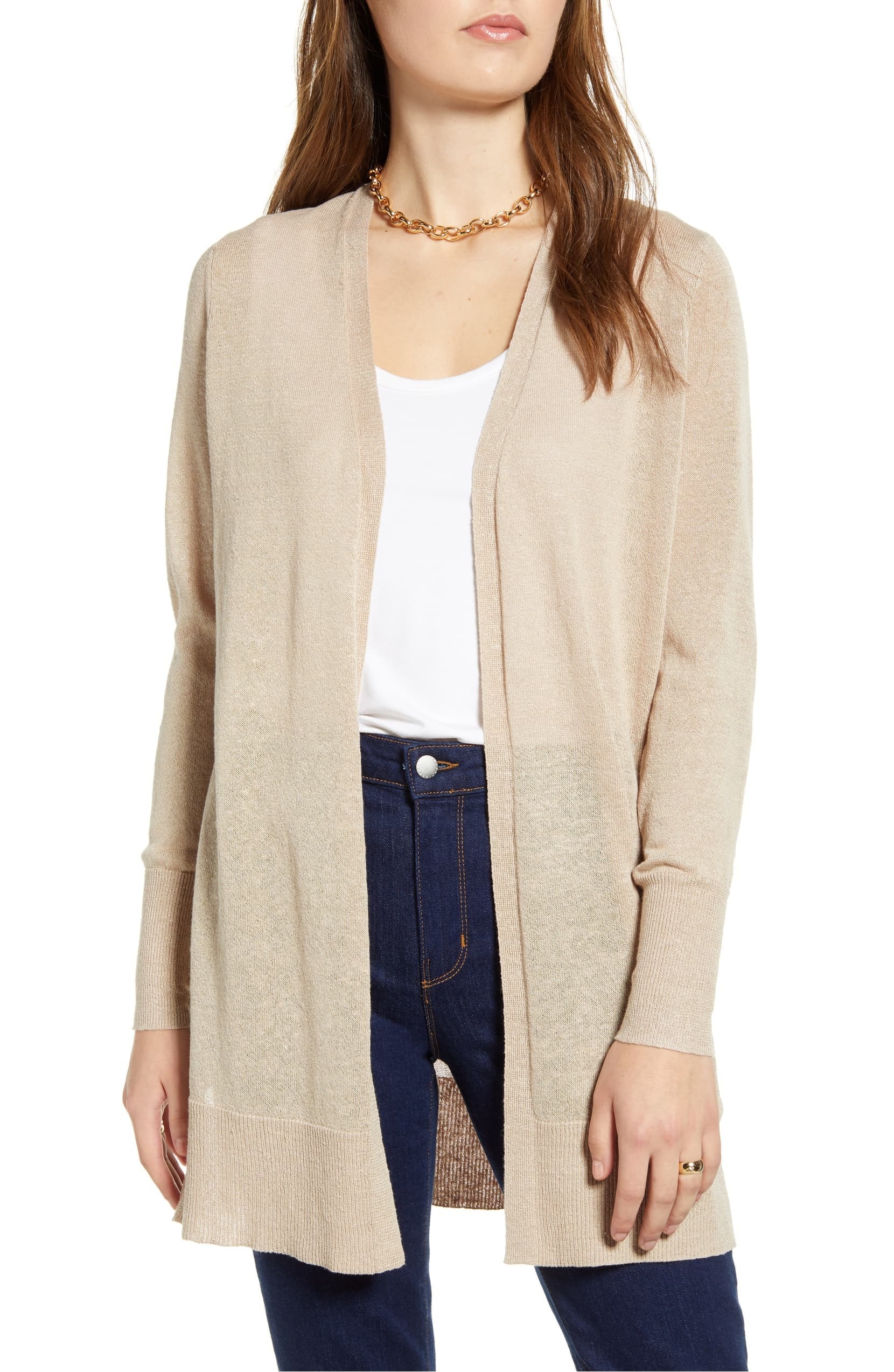 Model wearing Halogen side slit cardigan in tan cobblestone layered over a white tee paired with jeans 