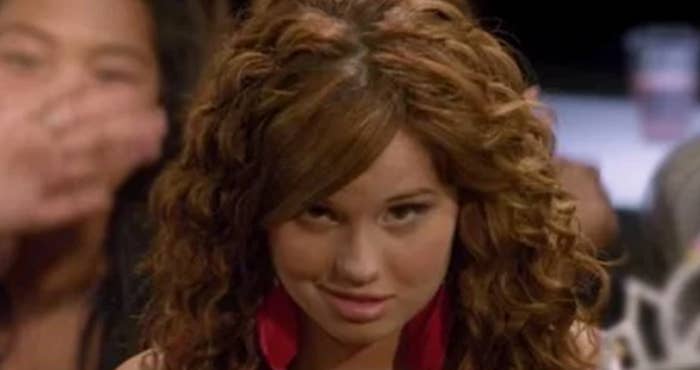 Debby&#x27;s character Tara making a weird, cringe smirk 