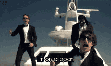 gif of the band Lonely Island and T-Pain on a boat saying &quot;I&#x27;m on a boat&quot;