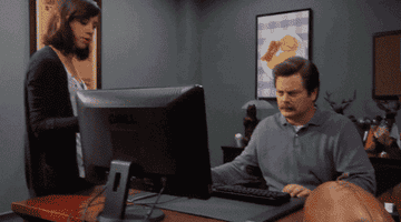 Ron Swanson angrily throwing out his computer.