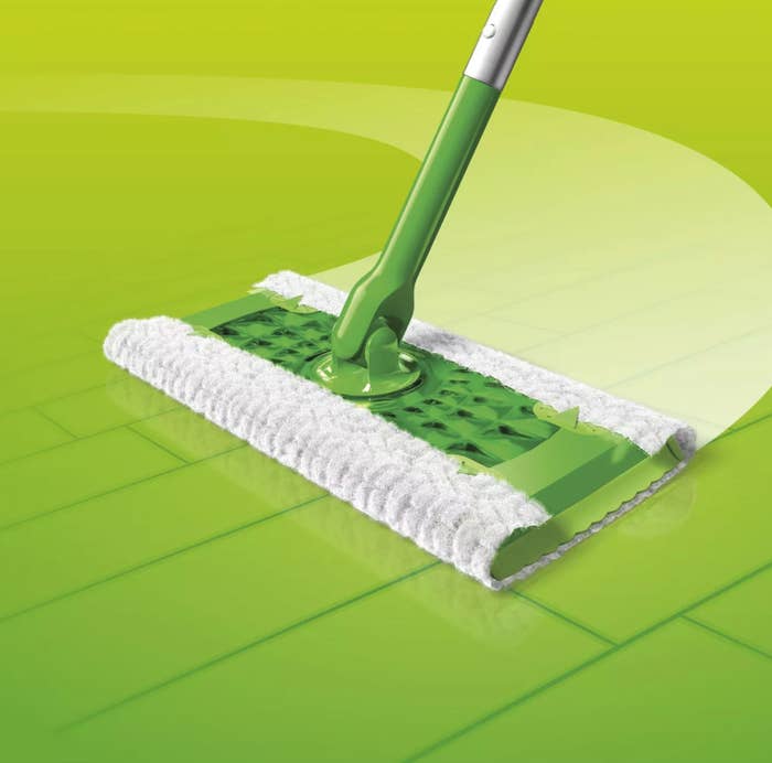 Green Swiffer Sweeper with soft sweeping cloth wipes grime from a hardwood floor