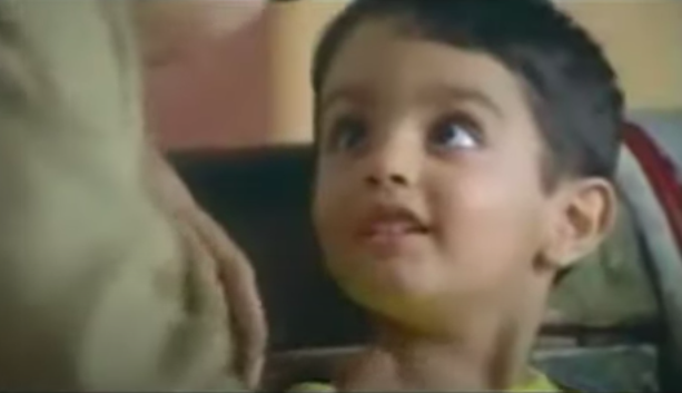 Image of a small child from an Indian commercial for Dhara Oil.