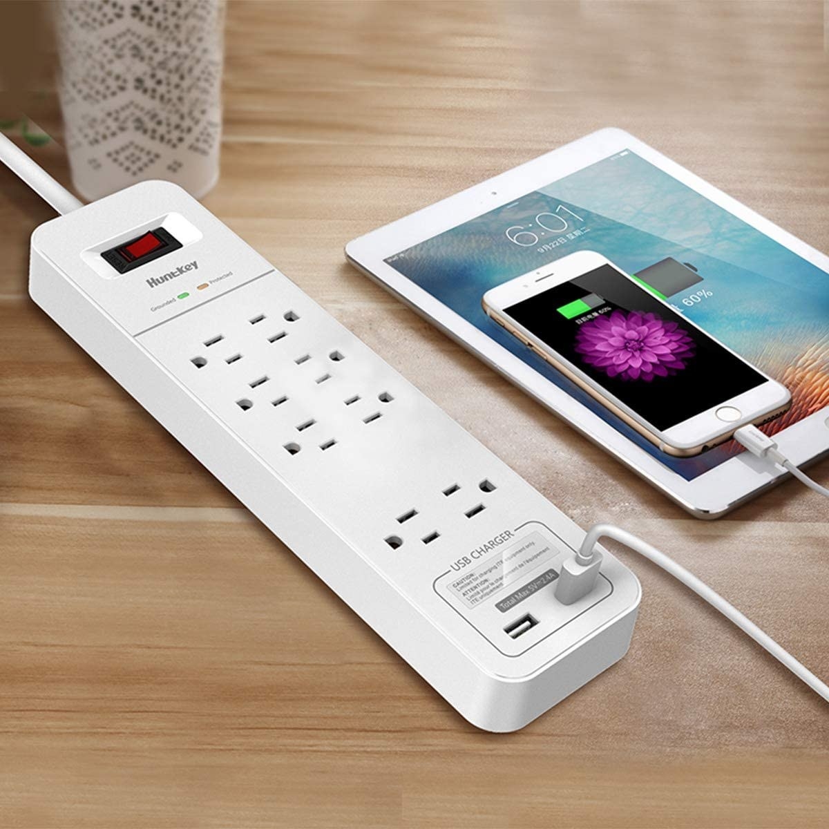 A long power bar with eight outlets along with two USB ports