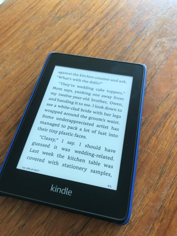 The Kindle on a wooden table