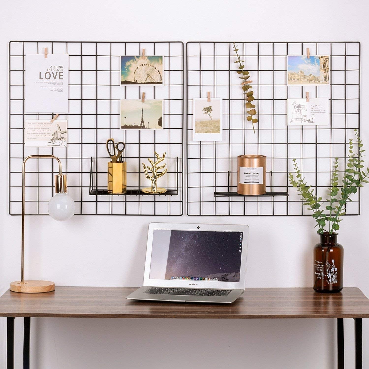 Two grid panels arranged over a desk and filled with postcards and pictures