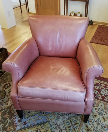 Reviewer image of a faded red leather chair