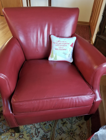 Same reviewer showing the same chair after using the polish to restore a vibrant red color