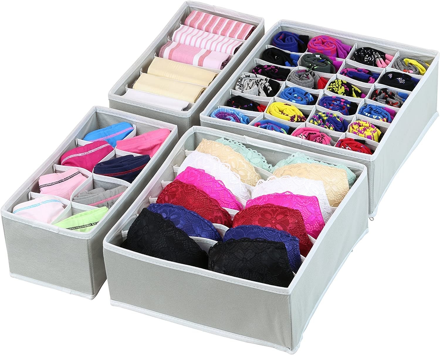 four gray compartmentalized drawer organizers