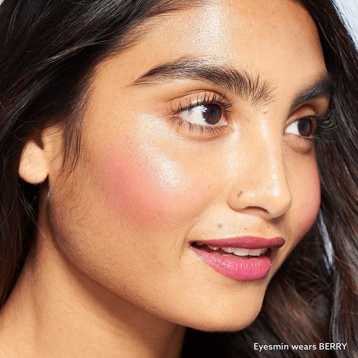 Model wearing blush in shade Berry, demonstrating how it looks on South Asian skin