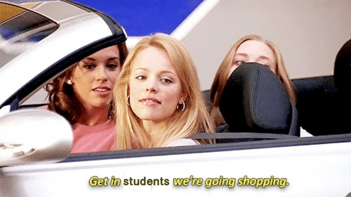 Three people in a car saying get in students, we&#x27;re going shopping