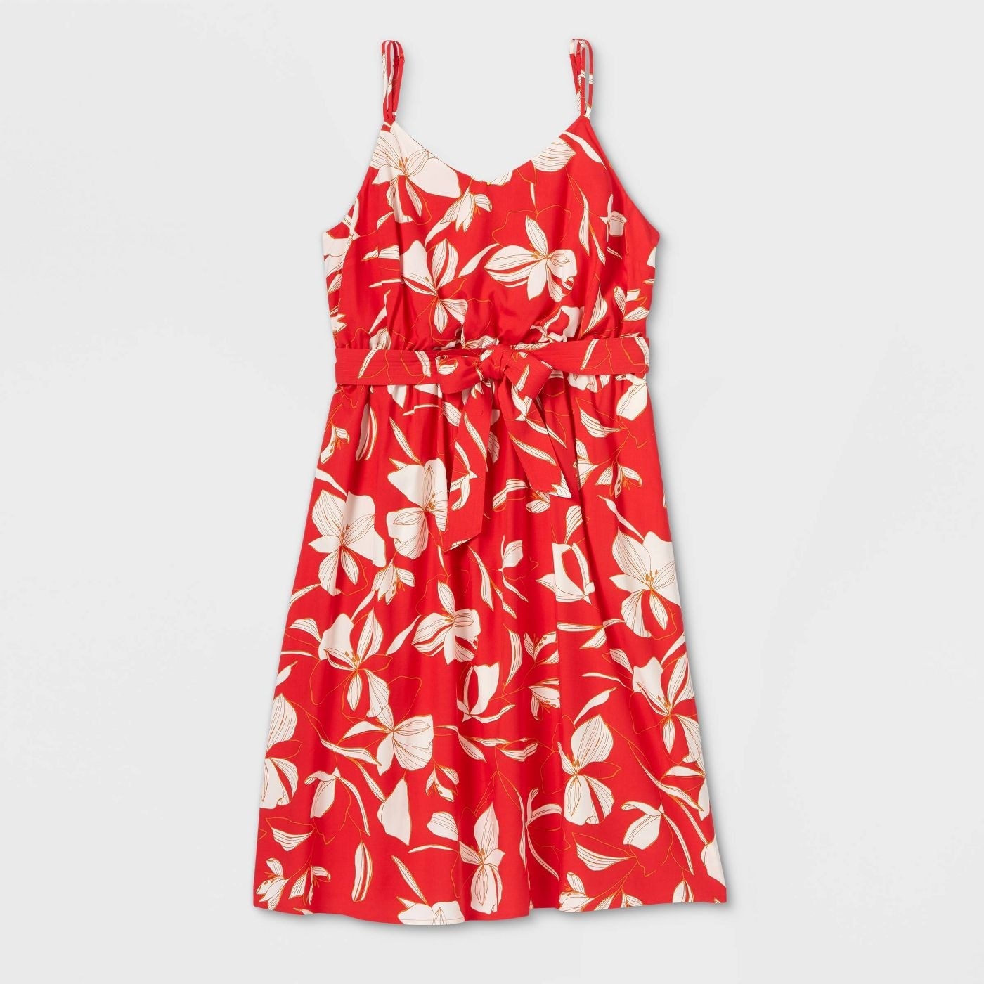 Red dress with white floral print and a bow at the waist 