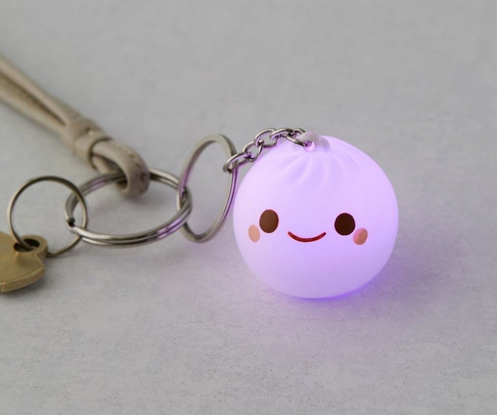 The dumpling-shaped light glowing in purple. It has a cute smiley face
