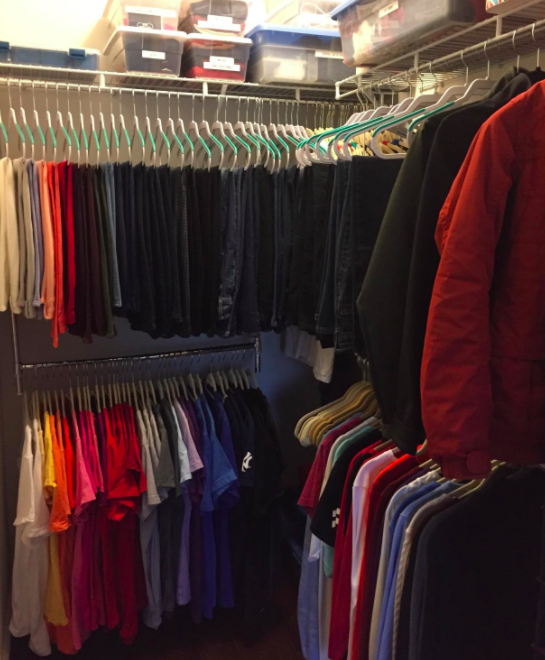 A customer review photo of the Simple Houseware adjustable closet hanging rod in chrome hanging in their closet.