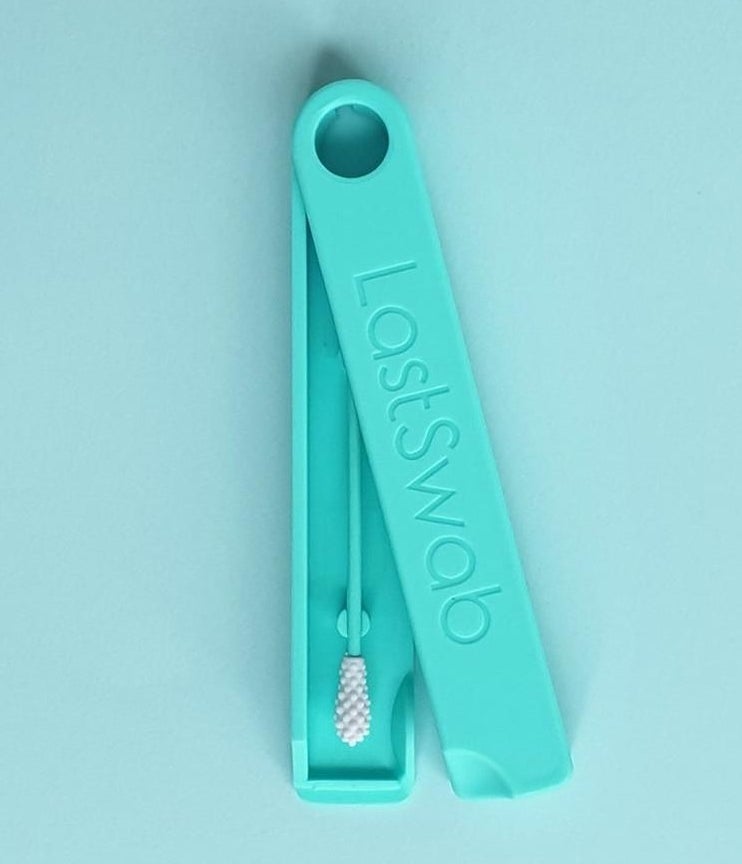 The LastSwab in teal in the carrying case