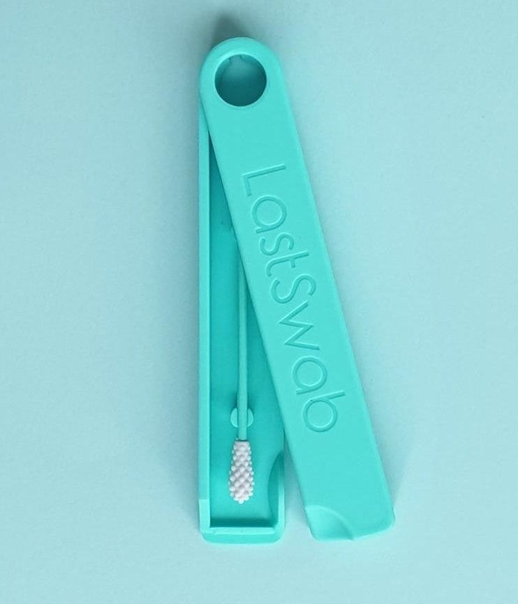 The LastSwab in teal in the carrying case