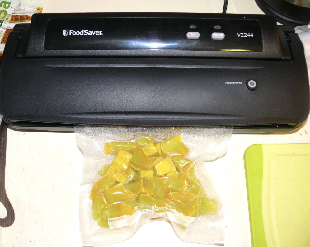 A reviewer image of cut up vegetables vacuum sealed from the appliance 