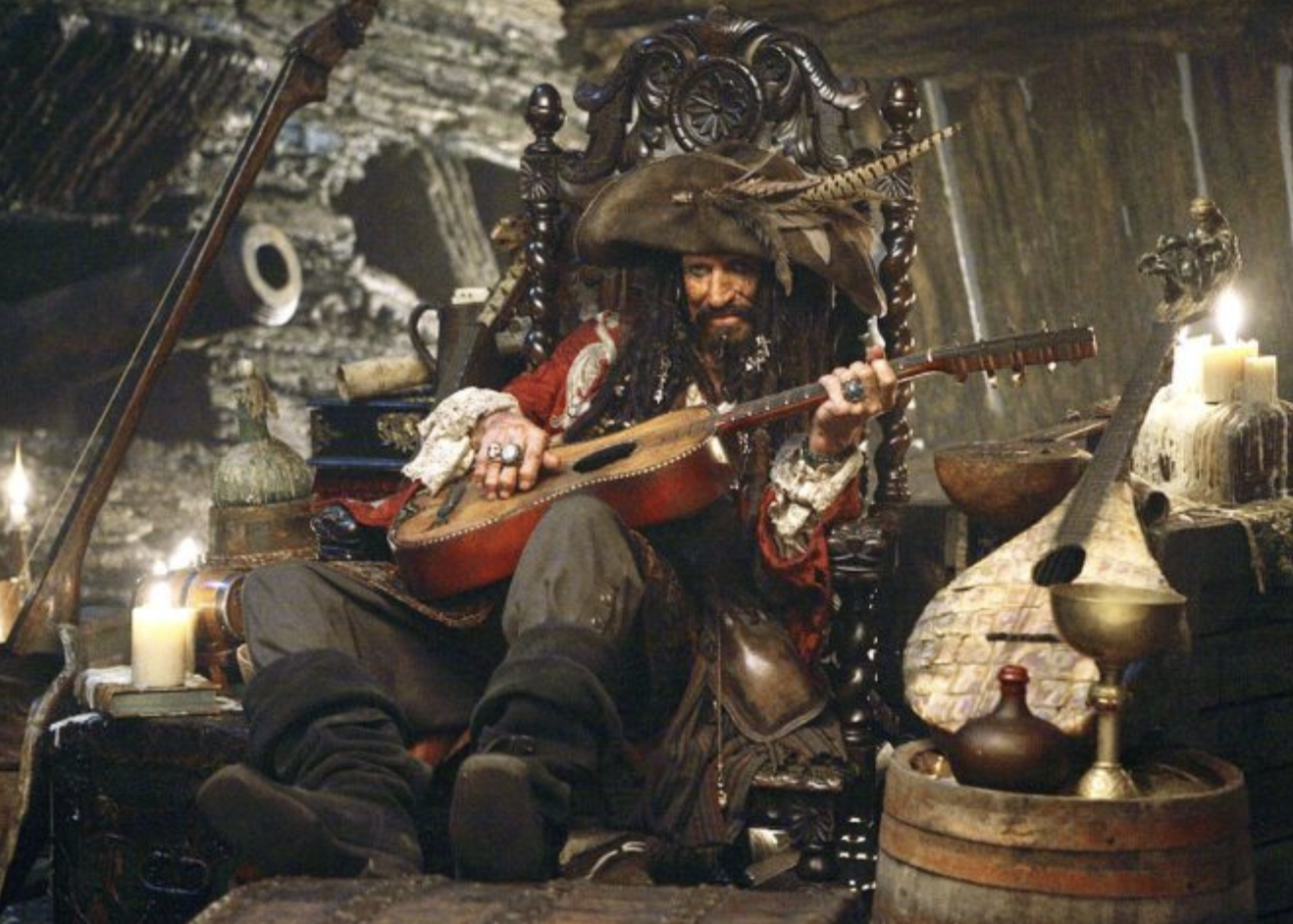 Keith Richards in pirate&#x27;s garb strumming a guitar