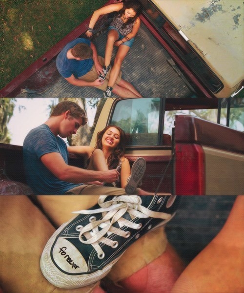 Stacked image in which Miley Cyrus sits on the back of a track in a pair of short shorts and a top with a boy in a blue t shirt. In image 1 he takes her converse shoe, and in images 2 and 3 he writes forever on the front in marker