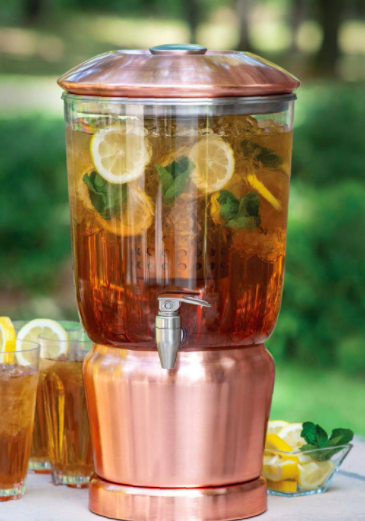 Rose gold beverage dispenser with lemon-infused water inside