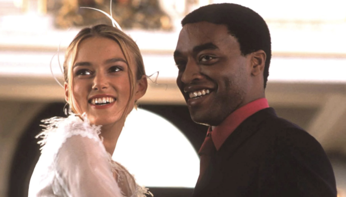 Juliet and Peter smiling in their wedding clothes