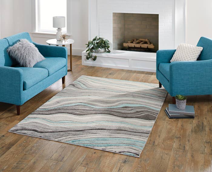 The blue and gray wavy designed rug