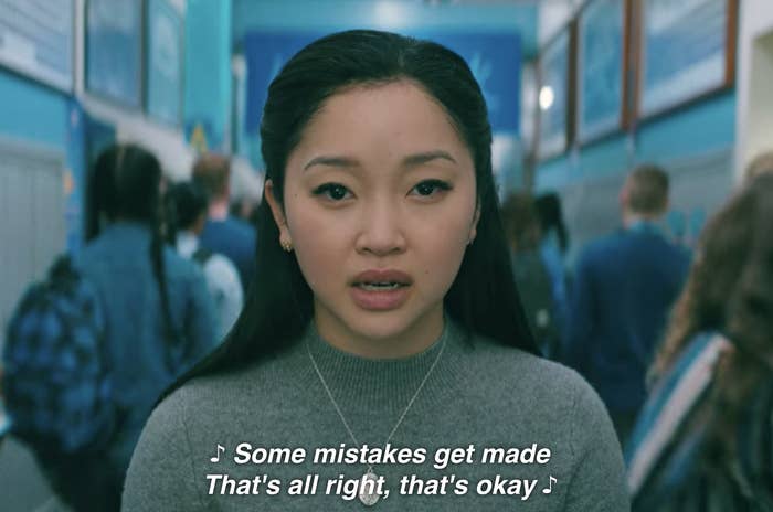 Lara Jean singing &quot;Some mistakes get made, that&#x27;s all right, that&#x27;s okay&quot; in the school hallway