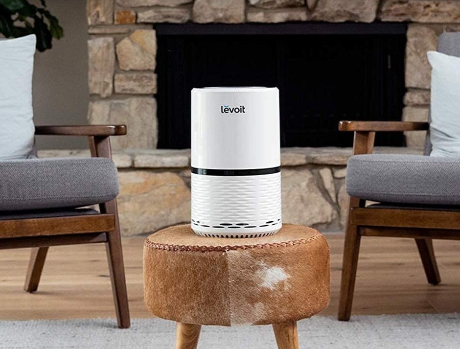 The air purifier working to clean in the air in a living room