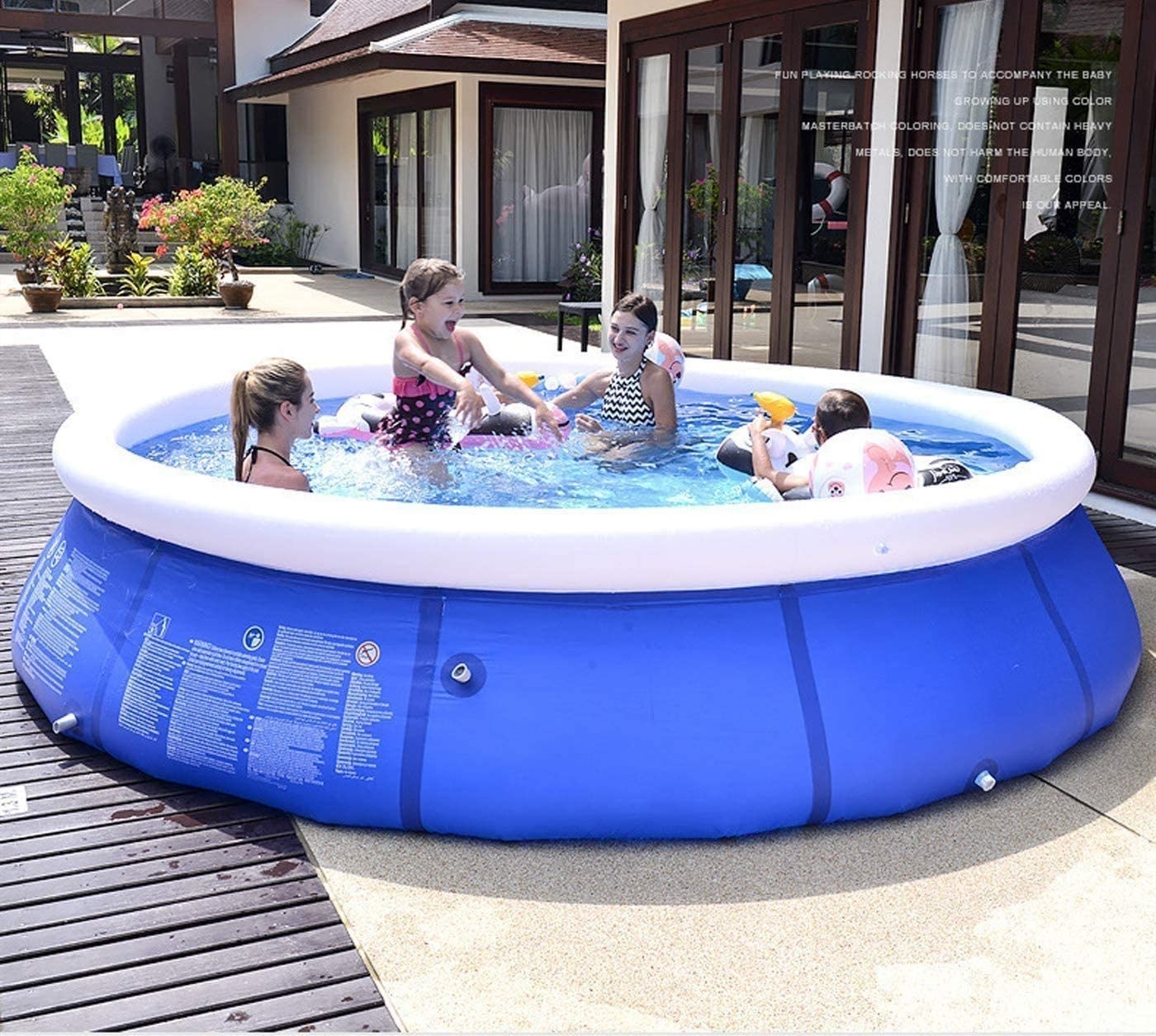 A circular family-sized pool with four people inside