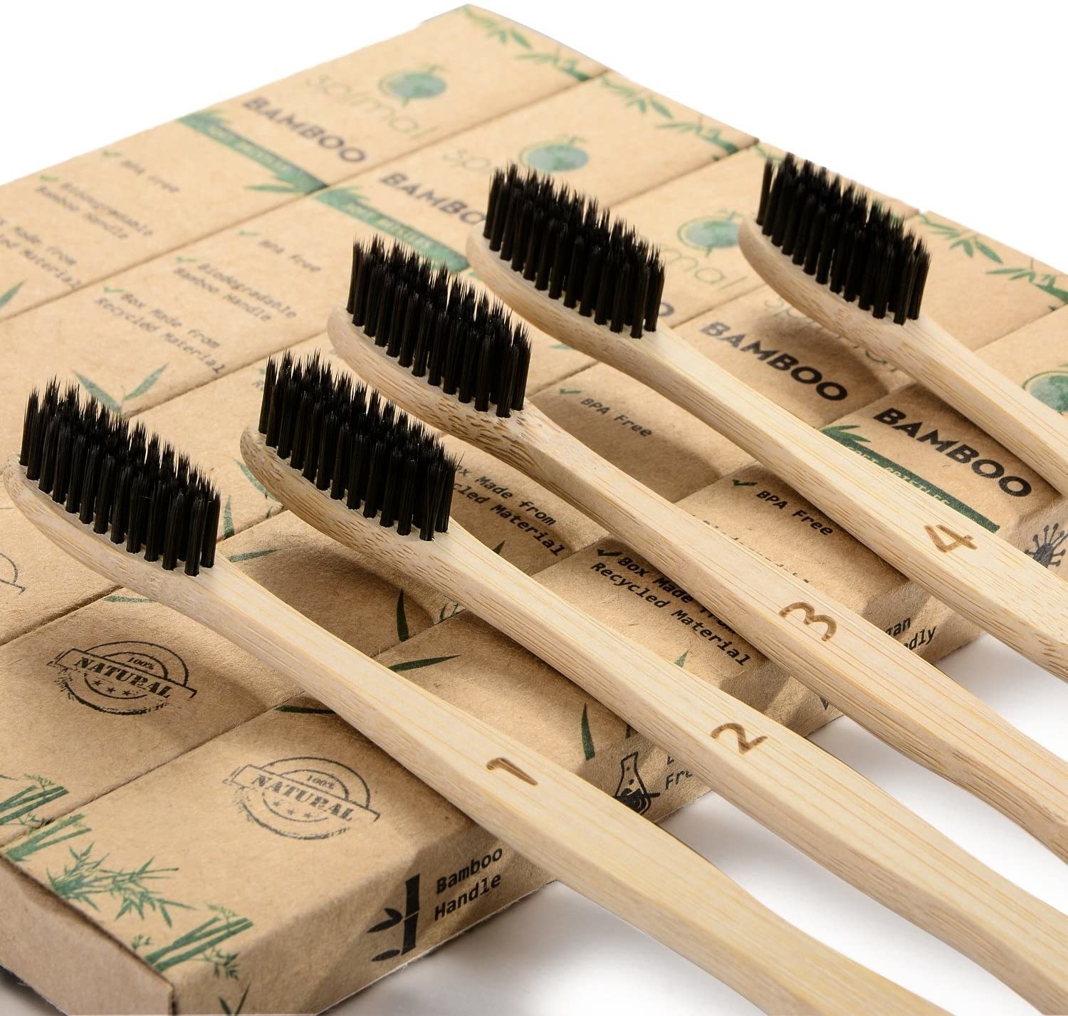 A close up of the five bamboo toothbrushes with charcoal infused bristles