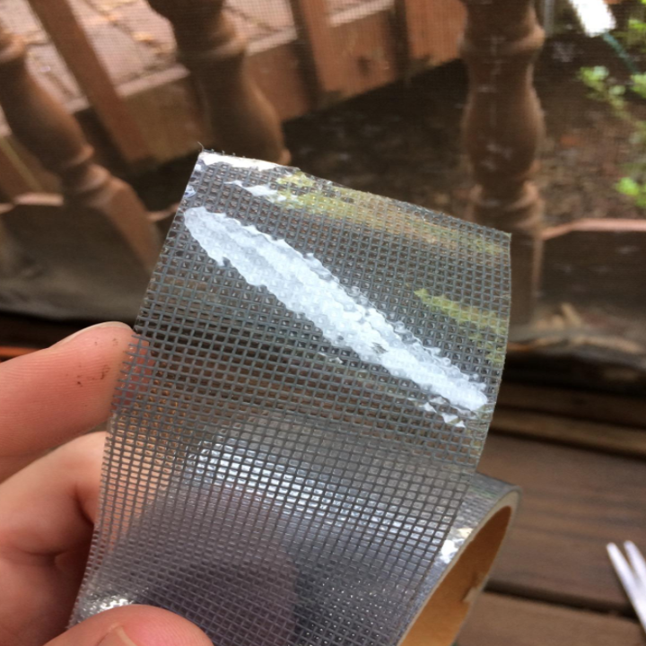 A reviewer holds the opened tape roll that looks similar to a screen