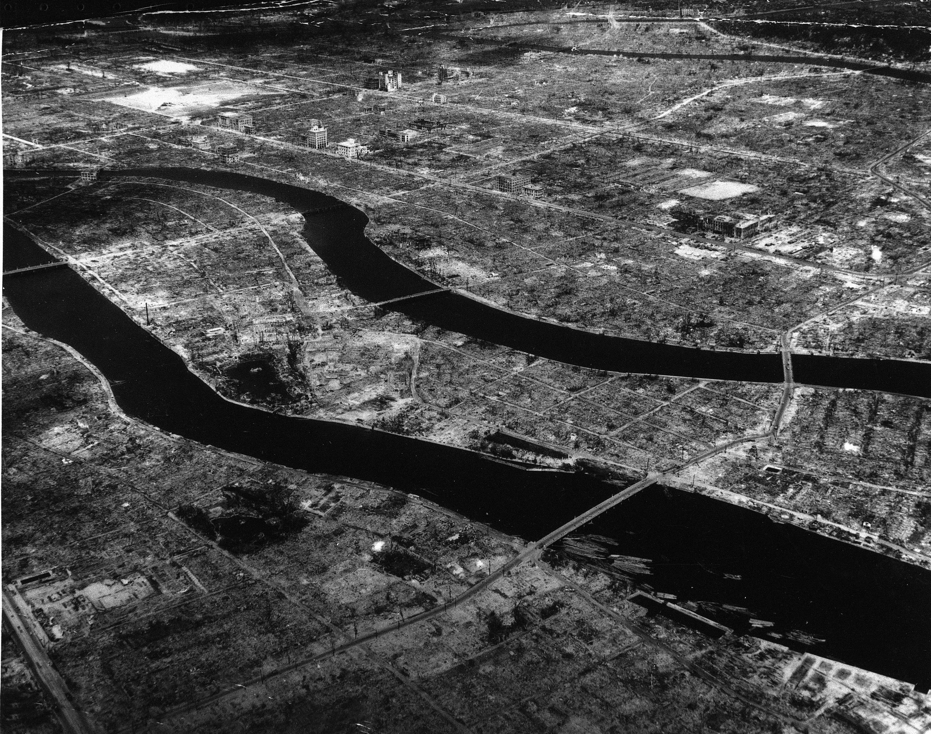 Two rivers cut through a desolate landscape where a city once stood. 