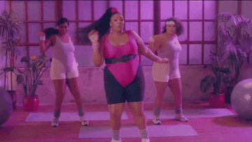 Gif of Lizzo working out in an &#x27;80s-themed video